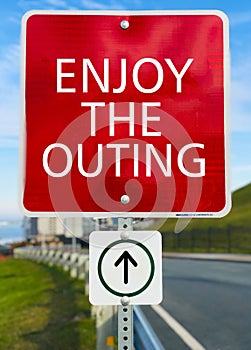 Enjoy the outing red sign board