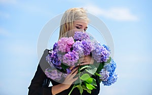 Enjoy spring without allergy. Gentle flower for delicate woman. Girl tender blonde hold hydrangea flowers bouquet