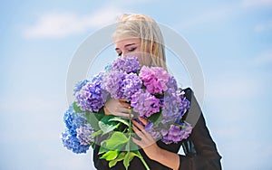 Enjoy spring without allergy. Gentle flower for delicate woman. Girl tender blonde hold hydrangea flowers bouquet