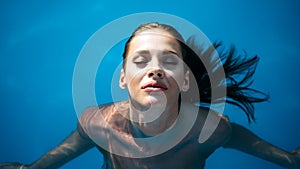 Enjoy the summer. Woman relaxing in the pool water