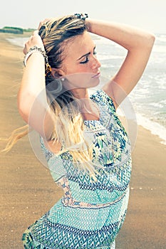 Enjoy the summer. Young beautiful woman at the sea.