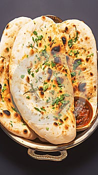 Enjoy Tandoori naan, a classic accompaniment to Indian dishes.