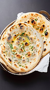 Enjoy Tandoori naan, a classic accompaniment to Indian dishes.