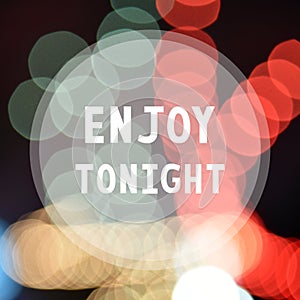 Enjoy tonight on colorful bokeh background photo