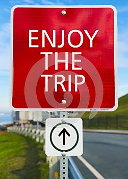 Enjoy the trip red sign board