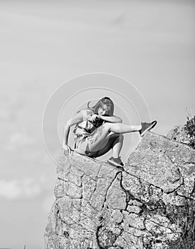 Enjoy the view. Tourist hiker girl relaxing edge cliff. Dangerous relax. Extreme concept. On edge of world. Woman sit on