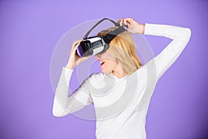 Enjoy virtual reality. Woman hold vr headset glasses violet background. Digital device and modern opportunities. Virtual