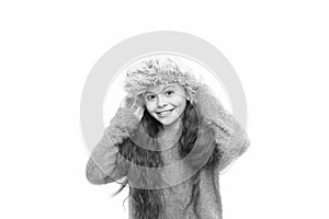 Enjoy the weather. cheerful little kid isolated on white. ready for winter cold. small girl earflap hat. her favorite