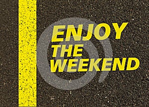 Enjoy the weekend written on the road.