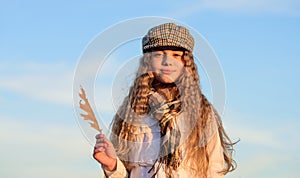 Enjoying autumn day. stylish small girl in fall beret. autumn trends. kid fashion look. sky weather. happy childhood