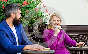 Enjoying beautiful morning. First meet of girl and mature man. woman and man with beard relax in cafe. Couple in love on