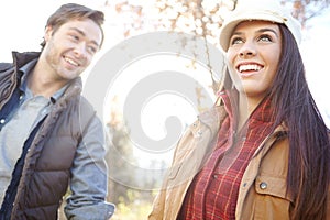 Enjoying the beauty of nature. A happy young couple spending time together out in nature.