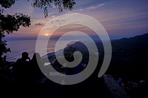 Enjoying the beauty sunset from hill, with beach view