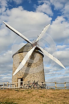 Enjoying break during bike trip near windmill