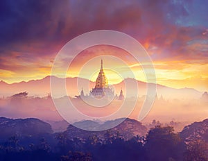 Enjoying colorful sunset over of Buddhist stupas and hot air balloon in the ancient Bagan. Myanmar, Asia