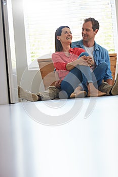 Enjoying a cosy and relaxing weekend together. a mature couple relaxing together at home.