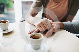 Enjoying the day out as a couple. a young couple grabbing a cup of coffee together.