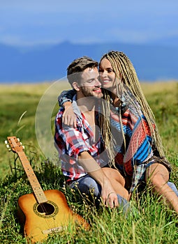 Enjoying each other. Family hike. Boyfriend and girlfriend with guitar in mountains. Summer hike. Breathtaking feelings