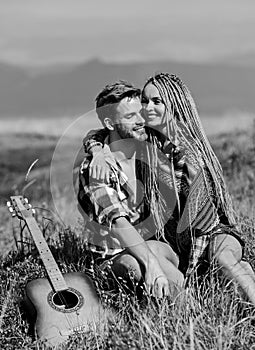 Enjoying each other. Family hike. Boyfriend and girlfriend with guitar in mountains. Summer hike. Breathtaking feelings