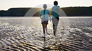 Enjoying Evening On The Beach Children Running In The Evening Sun