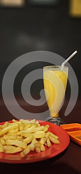 Enjoying French Fries and Orange Juice at Klinik Cafe in the evening