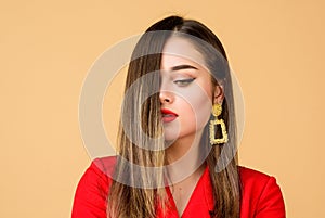 Enjoying gorgeous hair. Balayage hair color technique. Pretty woman makeup face red lips. Woman wear glamorous earrings