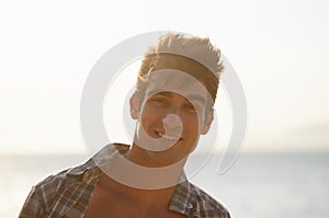 Enjoying his time off at the beach. a handsome young man on the beach.