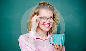 Enjoying hot coffee. school teacher need coffee break. woman with coffee cup at blackboard. good morning. girl