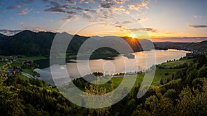 Enjoying the last sunlight over Lake Schliersee in bavarian mountain range.