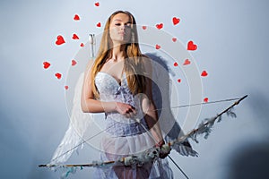 Enjoying magic moment. Arrow of love. Happy Valentines day - copy space. Cupid in valentine day. Charming curly woman in