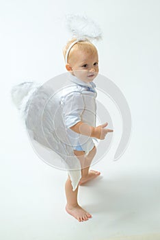 Enjoying magic moment. Little boy with angel wings and halo. Baby angel. Adorable little angel boy. Cute valentines
