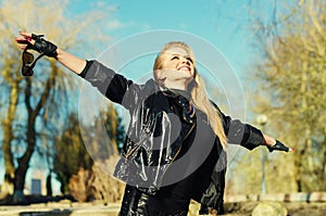 Enjoying the nature and life. Young woman arms raised enjoying t