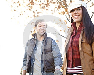 Enjoying a nature walk together. A happy young couple spending time together out in nature.