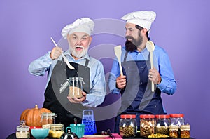 Enjoying new great day. Healthy food cooking. Chef men cooking. cheerful men prepare food. mature senior bearded men in