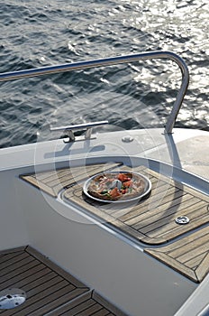 Enjoying pizza on a yacht is even more beautiful.  Included in 100 things to do.