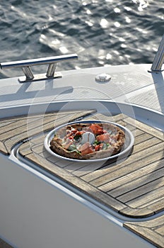 Enjoying pizza on a yacht is even more beautiful.  Included in 100 things to do.