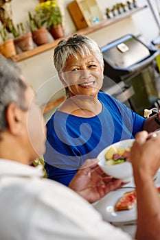 Enjoying a relaxing and healthy breakfast together. a happy senior couple enjoying a leisurely breakfast together at