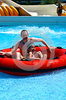 Enjoying the slide with daddy