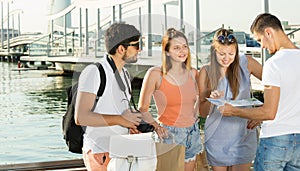 enjoying tourists looking at the map