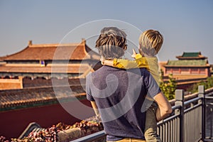 Enjoying vacation in China. Dad and son in Forbidden City. Travel to China with kids concept. Visa free transit 72 hours