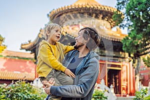 Enjoying vacation in China. Dad and son in Forbidden City. Travel to China with kids concept. Visa free transit 72 hours