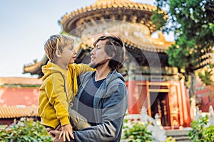 Enjoying vacation in China. Dad and son in Forbidden City. Travel to China with kids concept. Visa free transit 72 hours