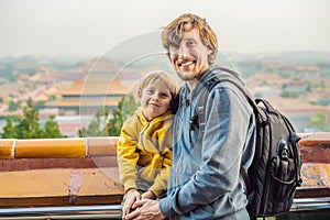 Enjoying vacation in China. Dad and son in Forbidden City. Travel to China with kids concept. Visa free transit 72 hours