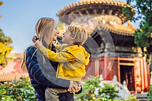 Enjoying vacation in China. Mom and son in Forbidden City. Travel to China with kids concept. Visa free transit 72 hours