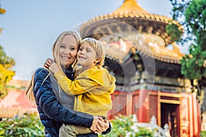 Enjoying vacation in China. Mom and son in Forbidden City. Travel to China with kids concept. Visa free transit 72 hours
