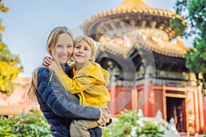 Enjoying vacation in China. Mom and son in Forbidden City. Travel to China with kids concept. Visa free transit 72 hours