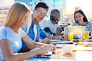 Joyful man working in a team
