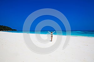 Enjoyment. Seashore. Happy free woman Raising Hands or Open arms
