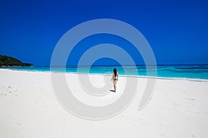 Enjoyment. Seashore. Happy free woman on tropical beach, exotic