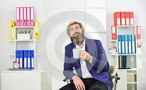 Enjoyment. Tea time. You have to trust your instincts. Relax and keep calm. Businessman drink coffee in office. Drink photo